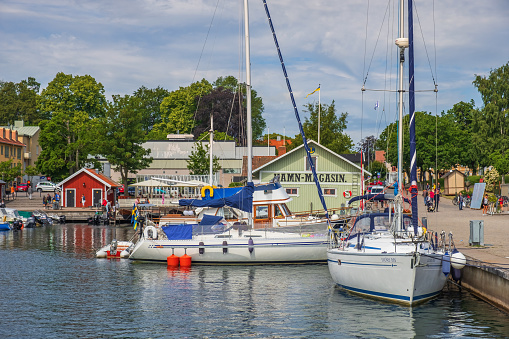 Hjo, Sweden-July, 2020: Boats at the quayside in the Swedish city of Hjo