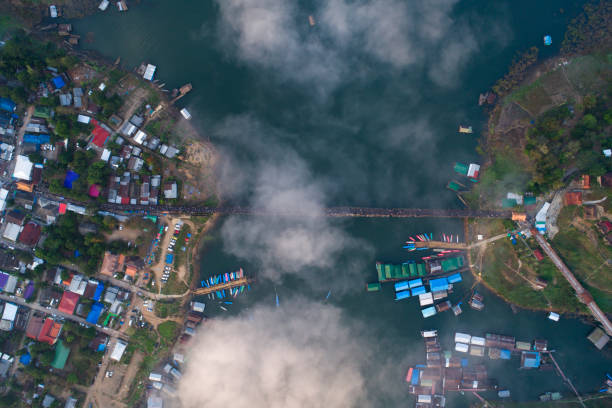 An old wooden bridge at  Sangkhla Buri, Thailand Morning aerial view of Mon Bridge An old wooden bridge at Sangkhla Buri, Kanchanaburi, Thailand sangkhla stock pictures, royalty-free photos & images