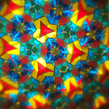 Abstract colored background. Real photo shot of a Kaleidoscope.