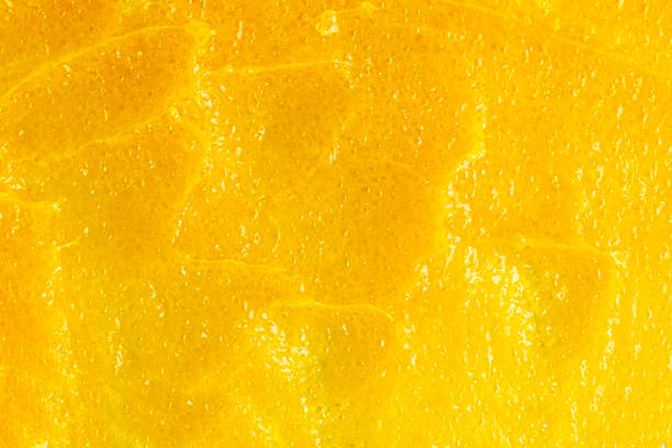 istock Texture of bright yellow mango body care scrub 1527619384