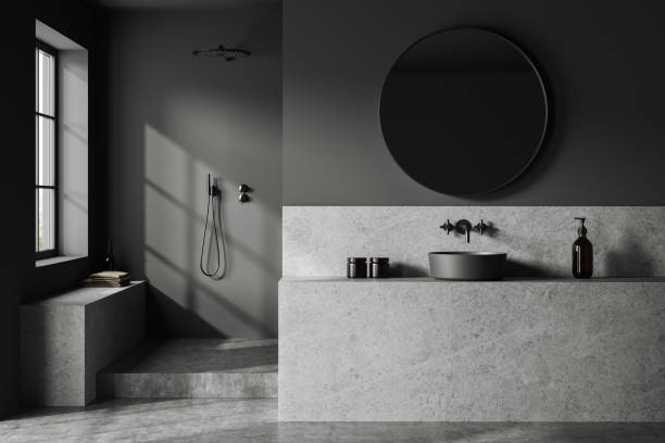 istock Grey home bathroom interior with sink and douche, partition and window 1527623549