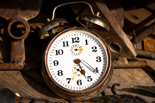 antique alarm clock on a wooden background