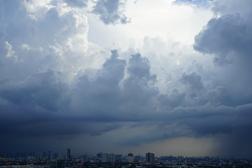 Rain clouds float in the sky above the houses of the city Thailand