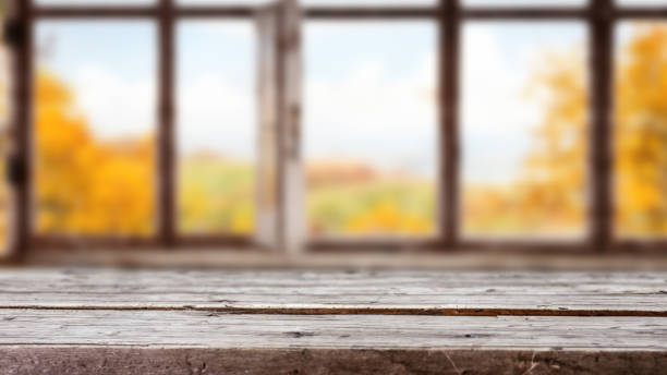 istock Empty space for your decoration Table background and blurred background of window with autumn landscape 1527709041