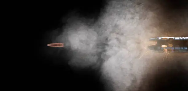 Photo of Bullet speeding out of a gun