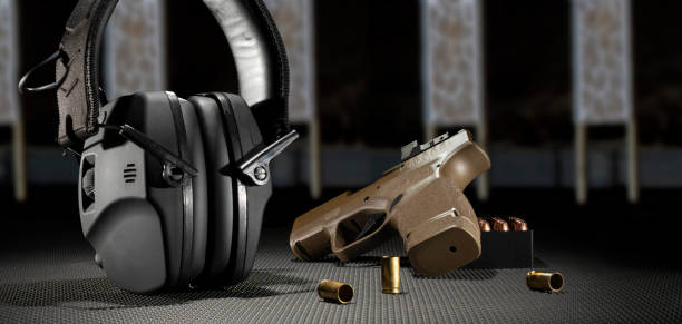istock Electronic hearing protection with pistol and ammo 1527720198