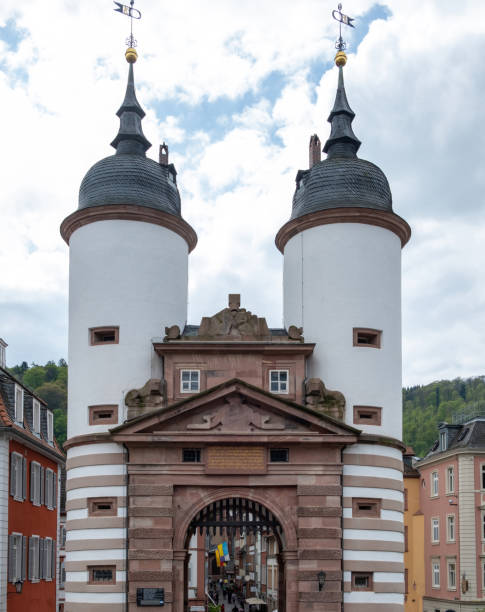 istock Germany, Heidelberg city. Old Bridge with large arched Gate between two white Tower. Vertical 1527764628