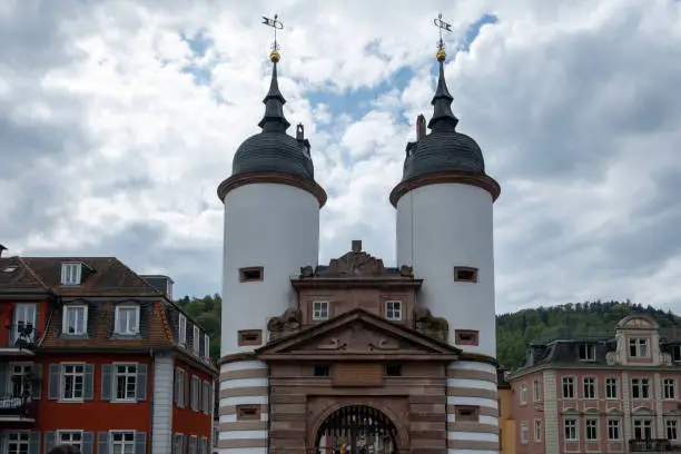 Photo of Germany, Heidelberg city. Old Bridge with large arched Gate between two white Tower.