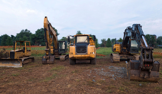 Parked construction equipment in a Northern Virginia, residential construction site.