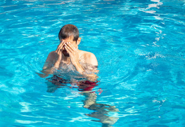 man with sore eyes at the swimming pool