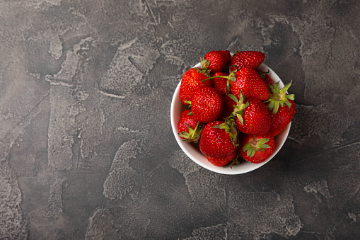 Fresh ripe juicy strawberries on a  table. Summer background composition with strawberries. Fruit concept.Vitamins.Eco berries. Copy space