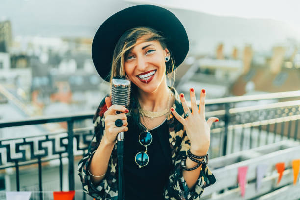 istock Portrait of singer on rooftop party 1527854086