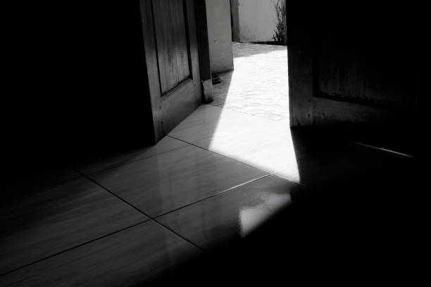 istock Reflected light on the floor from the light outside the door. 1527861600