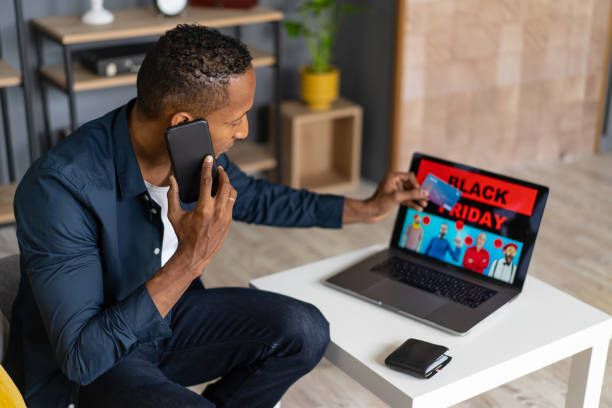 istock Man ordering a black friday bargain on his mobile 1527873916