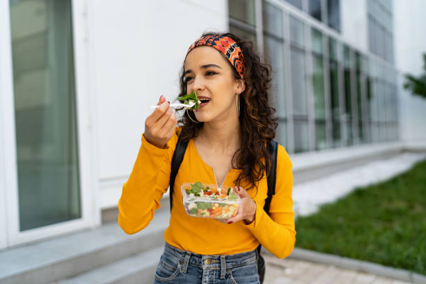 istock Woman enjoying in fresh salad 1527893971