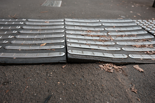 An old non-slip rubber mat that could be the cause of accidents.