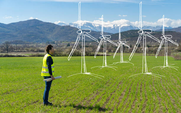 istock Concept illustration of wind turbines with engineer 1527906963