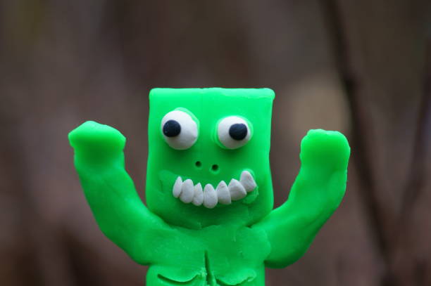 Funny monster made of green plasticine.