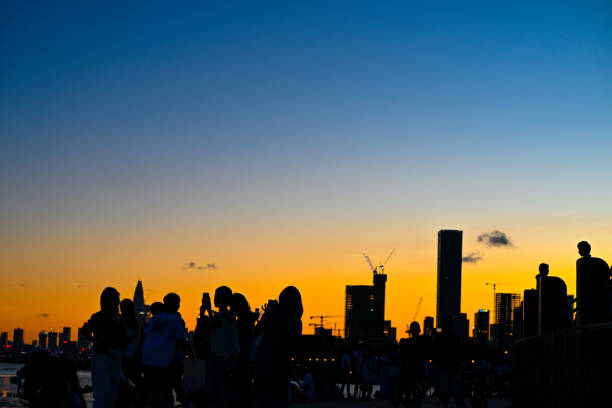 istock Seaside Sunset and Buildings 1527948126