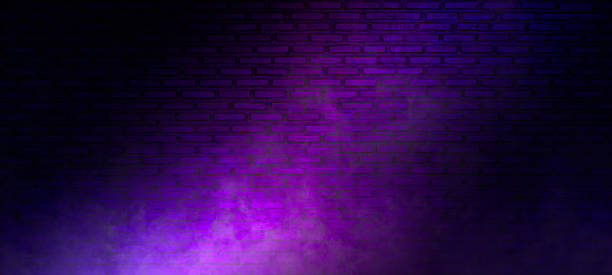 istock Brick wall texture pattern, blue, and purple background, an empty dark scene, laser beams, neon, spotlights reflection on the floor, and a studio room with smoke floating up for display products. 1527959452
