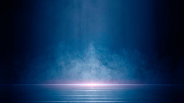 Dark stage shows, blue, and purple background, an empty dark scene, laser beams, neon, spotlights reflection on the asphalt floor, studio room with smoke floating up for display products. Dark stage shows, blue, and purple background, an empty dark scene, laser beams, neon, spotlights reflection on the asphalt floor, studio room with smoke floating up for display products. blue light room stock pictures, royalty-free photos & images