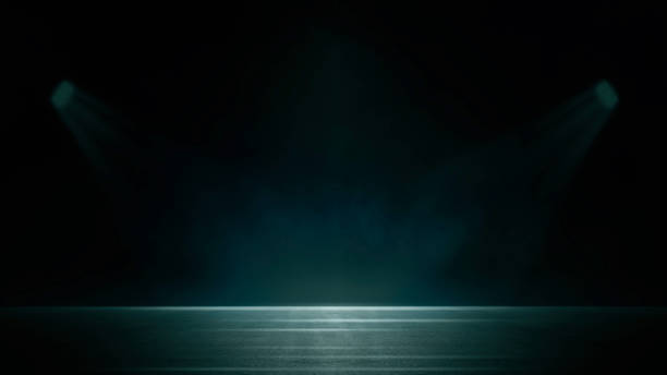 istock Dark stage shows, blue background, an empty dark scene, laser beams, neon, spotlights reflection on the asphalt floor, studio room with smoke floating up for display products. 1527959975
