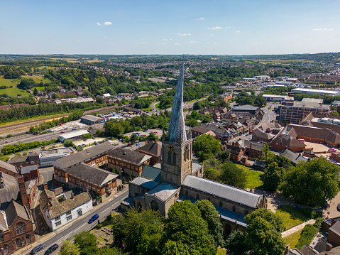 This aerial drone photo shows the famous church in Chesterfield. The church has a very strangly shaped church tower.