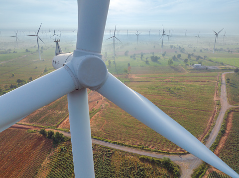 Close up Aerial view of wind turbine in the daytime,  Wind Energy and Sustainable Energy Technology concept