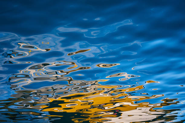 istock Abstract background with colorful blobs on the water 1528017033