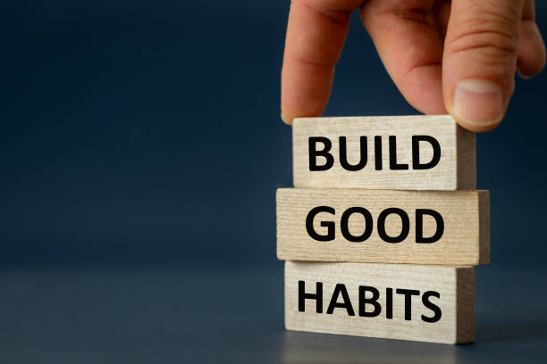 build good habits symbol, concept, wooden blocks with "build good habits" motto navy blue background, copy space, psychology, business, successful building good habits concept - addiction imagens e fotografias de stock