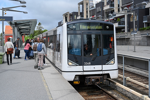Oslo, Norway, July 5, 2023 - A line 1 subway (T-Bane) heading towards Bergkristallen at Holmenkollen station, Oslo, Norway.