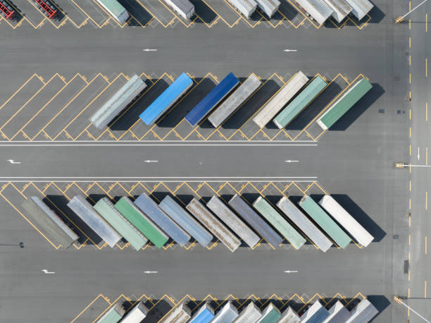 istock Bird's eye view of container transport trucks 1528051519