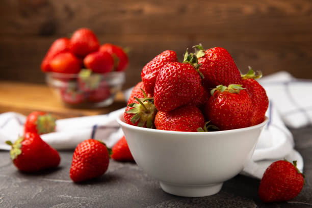 istock Fresh ripe juicy strawberries on a  table. Summer background composition with strawberries. Fruit concept.Vitamins.Eco berries. Copy space 1528067104