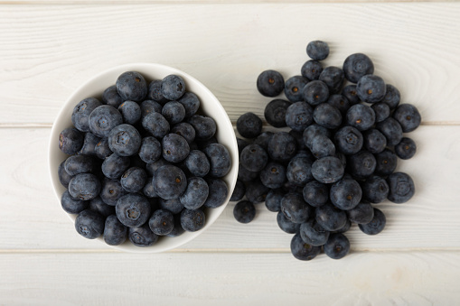 Blueberry. Ripe and fresh blueberries on texture background. Vitamins. Healthy food. Juicy berry. Copy space. Place for text