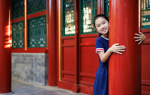 Little girl in a Chinese classical style building