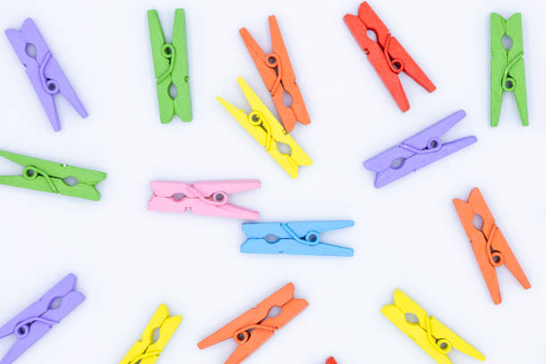 istock Wooden clothes pins isolated on the white background 1528073690