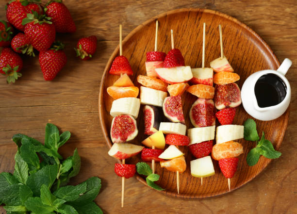 istock fruit salad with fresh berries and fruits 1528096329