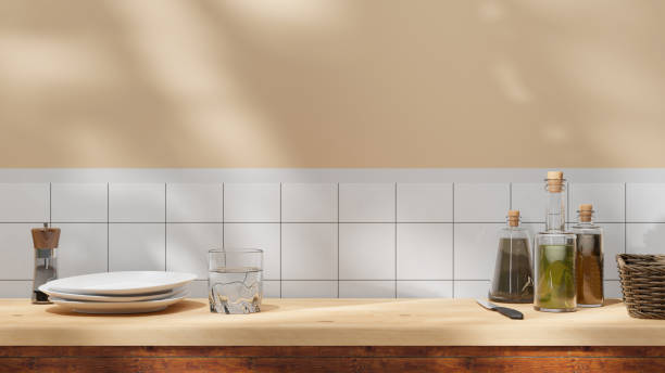 istock Kitchen wooden countertop background with sunlight beams and window and leaf shadows with copy space. wooden table empty space for presentation and design. cozy home summer background 1528118433