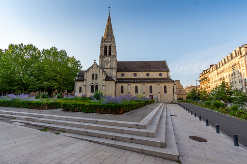 Maisons-Alfort, France - July 9, 2023: Exterior view of the Saint-Rémi church in Maisons-Alfort, France, in the French department of Val-de-Marne, a Catholic church dating back to the 12th century for its oldest parts