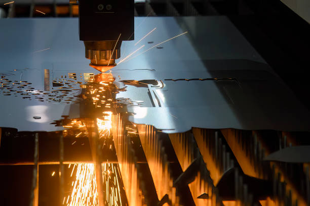 The fiber laser cutting machine cutting machine cut the metal plate. The fiber laser cutting machine cutting machine cut the metal plate. The hi-technology sheet metal manufacturing process by laser cutting machine. laser cutting metal stock pictures, royalty-free photos & images
