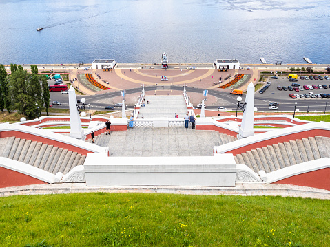 Nizhny Novgorod, Russia - June 26, 2023: above view of Chkalov Stairs and Lower Volga river embankment in Nizhny Novgorod city on sunny summer day