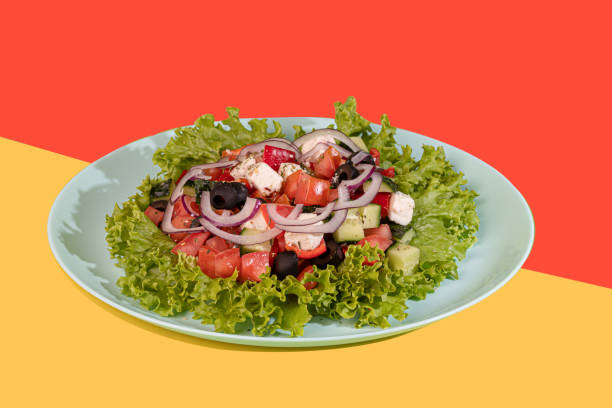 istock Salad with lettuce, chicken, cherry tomatoes and eggs. Seasoned with sauce. On a colored background. 1528251618