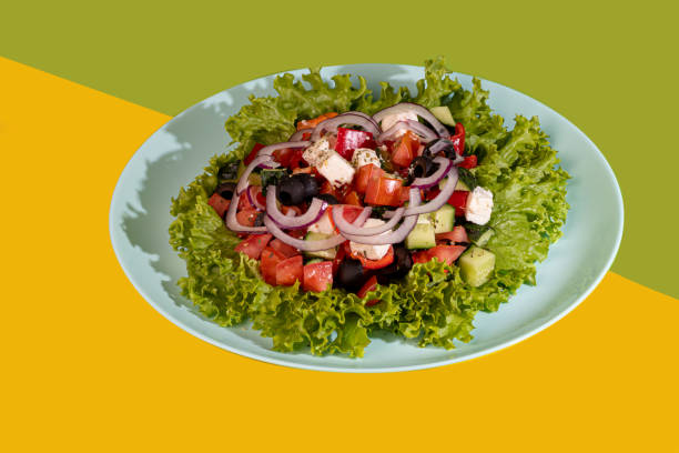 istock Salad with lettuce, chicken, cherry tomatoes and eggs. Seasoned with sauce. On a colored background. 1528251619