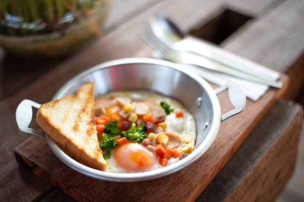 istock Delicious breakfast with sunny side up eggs,  pancakes,wood background 1528271492