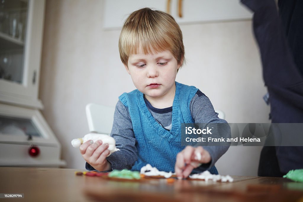Girl decorating gingerbread cookies  2-3 Years Stock Photo