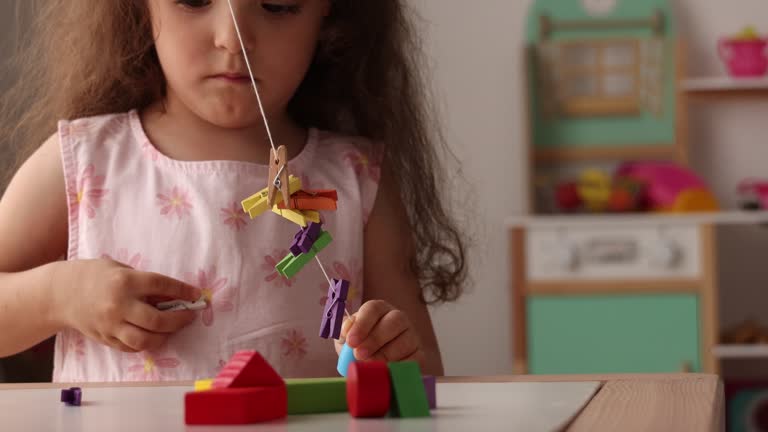 Little girl playing with her mother