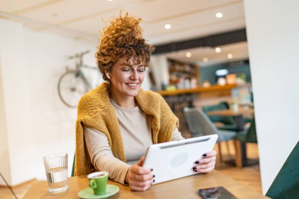 istock Young woman at coffee shop 1528352905