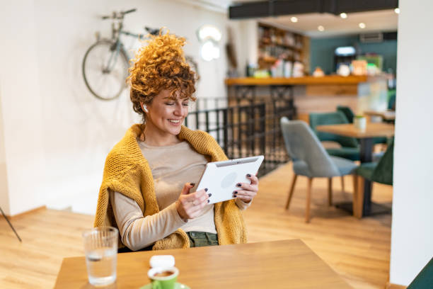 istock Young woman at coffee shop 1528354574