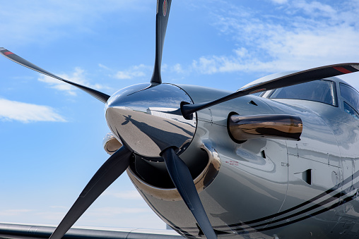 The nose, cone, propeller, and spinner of a modern turboprop airplane.