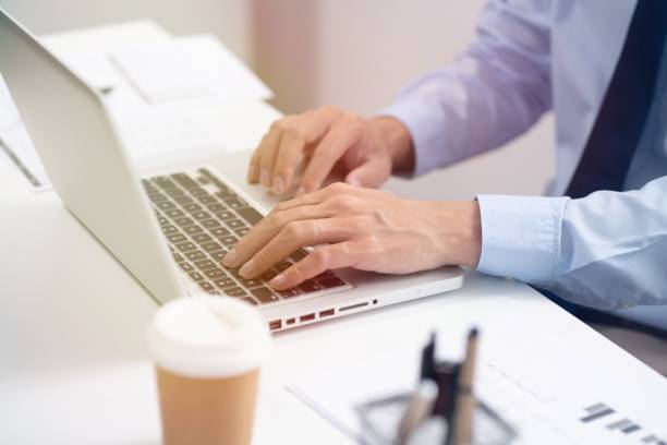 istock Business man working by using laptop computer Hands typing on a keyboard. Professional investor working new start up project. business planning in office. Technology business 1528389570
